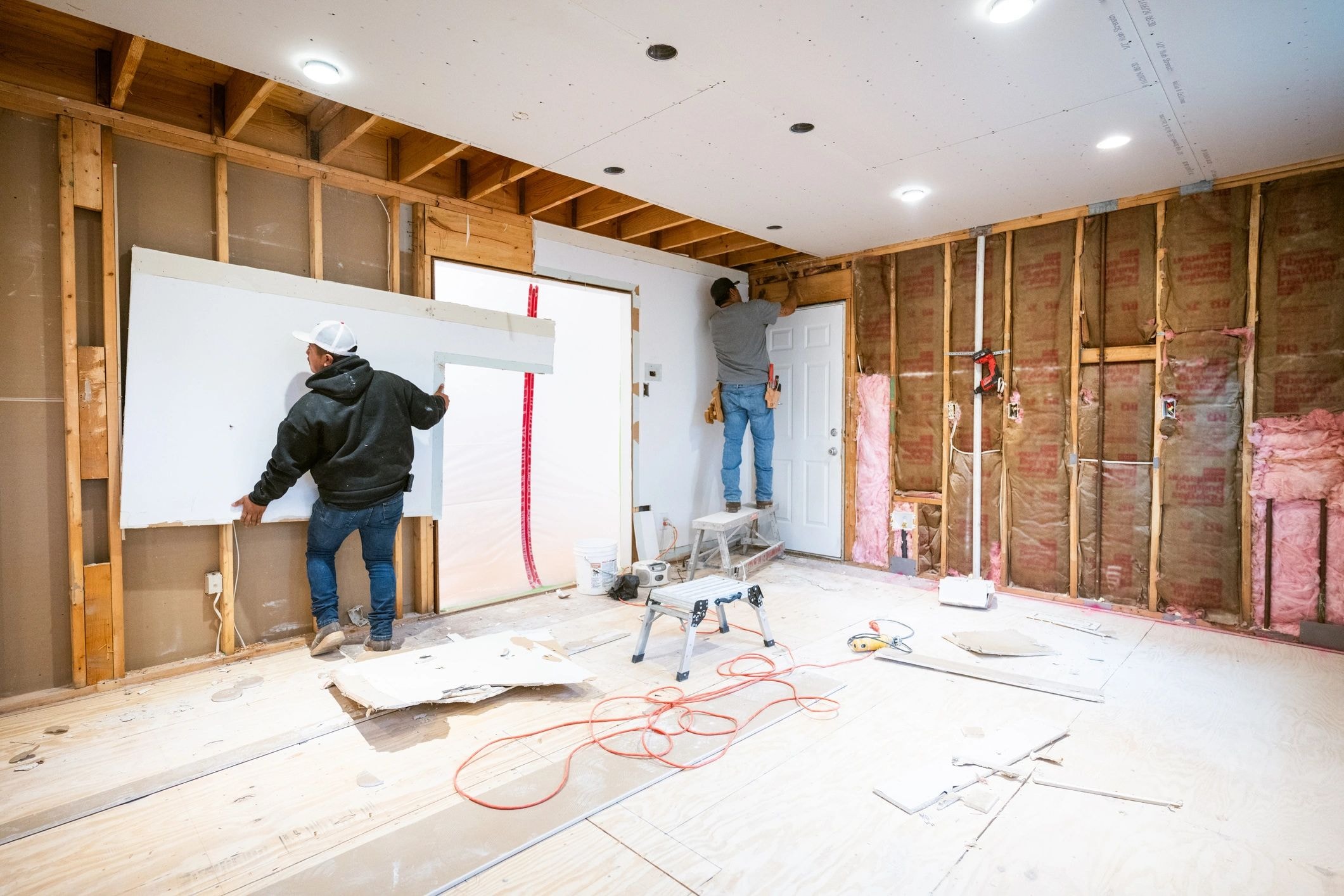 Interior home renovation with exposed framing and insulation in Del Mar, CA by Capps Construction
