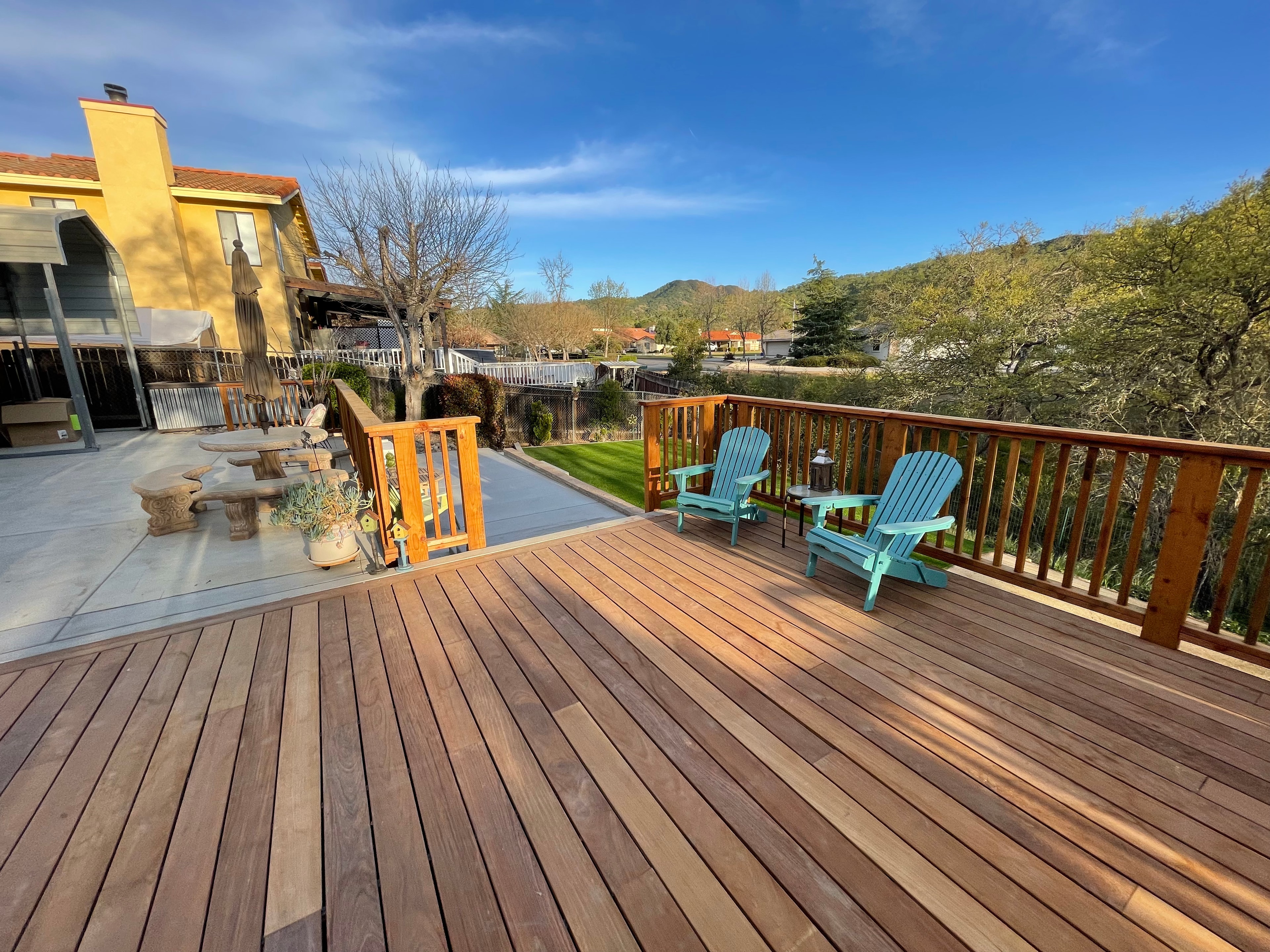 Hardwood deck with railings and mountain views by Capps Construction